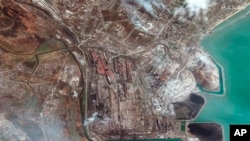 This satellite image provided by Maxar Technologies shows Azovstal Iron and Steel Works factory in Mariupol, Ukraine, April 9, 2022. 