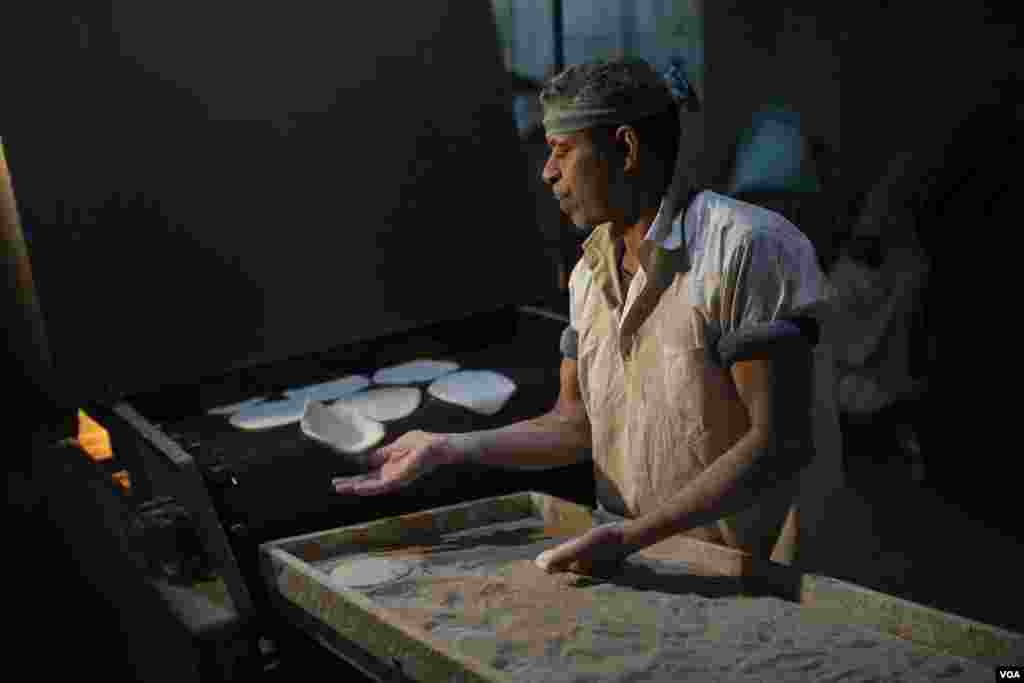 Hassan Elfarran, whose bakery produces 10,000 loaves of subsidized bread a day, fears that if the price of his products go up, 70 million of Egypt’s poor will suffer and expenses in Cairo will become unbearable for everyone on March 23, 2022. (Hamada Elra