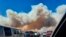 Smoke from the Tunnel Fire fills the sky in Doney Park, outside Flagstaff, Ariz., April 19, 2022. 