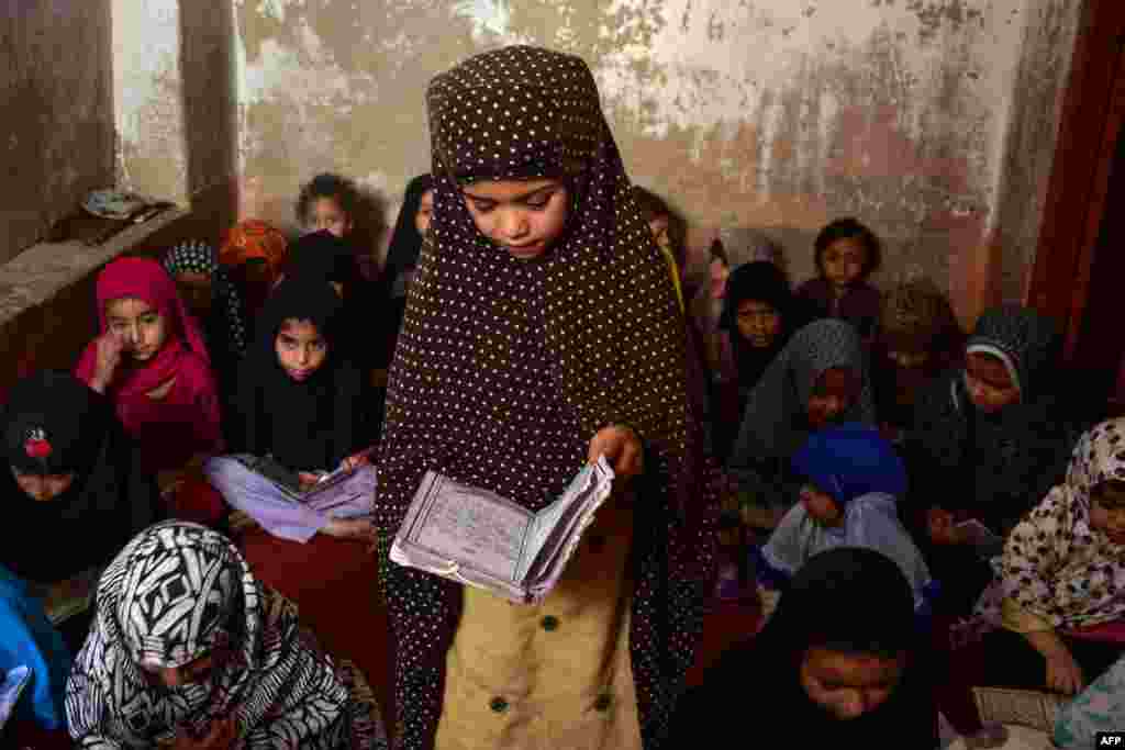 Children study inside a Madrassa or Islamic school in Kandahar, Afghanistan.