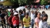 Residents line up to vote during the second round of the presidential election in Dili, East Timor, April 19, 2022.