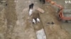 Drone Captures Recovery of Bodies from Bucha Mass Grave 