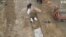 Drone Captures Recovery of Bodies from Bucha Mass Grave 