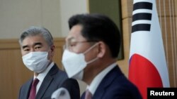 US Special Representative for North Korea, Sung Kim, watches as South Korea's Special Representative for Korean Peninsula Peace and Security Affairs Noh Kyu-duk speaks during a briefing at the Foreign Ministry in Seoul, South Korea, Apr. 18, 2022. 