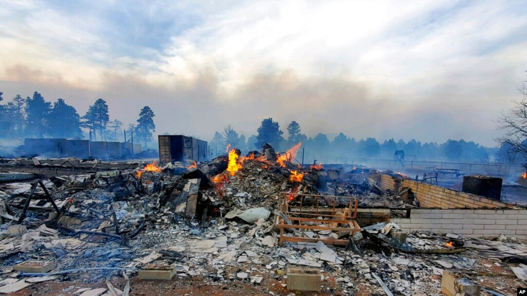 This April 20, 2022, photo provided by Bill Wells shows his home on the outskirts of Flagstaff, Ariz., destroyed by a wildfire on April 19, 2022. The wind-whipped wildfire has forced the evacuation of hundreds of homes and animals.