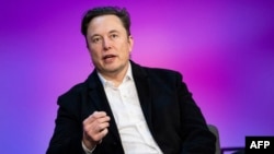 FILE - Tesla chief Elon Musk speaks at the TED2022: A New Era conference in Vancouver, Canada, April 14, 2022, in this handout image released by TED Conferences.