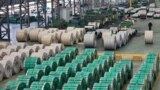 FILE - Steel rolls are seen at a holding area at a factory in Nantong in China's eastern Jiangsu province on March 1, 2022. 