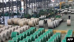 Steel rolls are seen at a holding area at a factory in Nantong in China's eastern Jiangsu province on March 1, 2022.