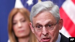 US Attorney General Merrick Garland announces the extradition and unsealing of an indictment charging former Honduran President Juan Orlando Hernandez with drug and firearms offenses, at the Department of Justice on April 21, 2022, in Washington.