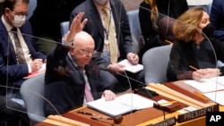 FILE - Russia's U.N. Ambassador Russia Vasily Nebenzya casts the lone dissenting vote in the United Nations Security Council, Friday, Feb. 25, 2022. Two days into Russia's attack on Ukraine, a majority of U.N. Security Council members voted to demand that