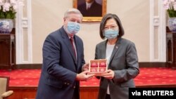 Taiwan President Tsai Ing-wen attends a meeting with U.S. Sen. Lindsey Graham at the presidential office in Taipei, Taiwan, in this handout picture released April 15, 2022.