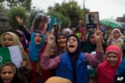 Kashmiris protest Friday against the abrogation of article 370, near Srinagar, Indian-controlled Kashmir, Oct. 4, 2019. For two months, mobile phone and internet services have been cut and the region stripped of its semi-autonomous powers.