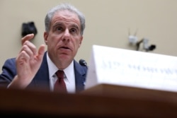 FILE - U.S. Justice Department Inspector General Michael Horowitz testifies on Capitol Hill, in Washington, Sept. 18, 2019.