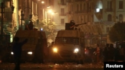 Egyptian riot police fire tear gas towards protesters during clashes in Cairo, April 6, 2013.