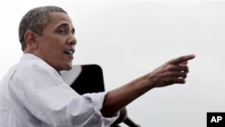 President Barack Obama speaks during a Labor Day event at Detroit's Renaissance Center, headquarters of General Motors, Sept., 5, 2011