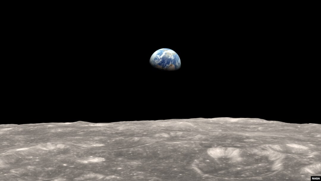 Illustration of Earth as seen from the moon. The gravitational tug-of-war between Earth and the moon raises a small bulge on the moon. The position of this bulge shifts slightly over time.