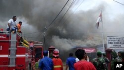 Smoke billows from Kabanjahe prison during a prison riot in Kabanjahe, North Sumatra, Indonesia, Feb. 12, 2020.