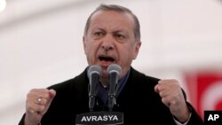 FILE - Turkey's President Recep Tayyip Erdogan speaks during the opening ceremony of the Eurasia Tunnel in Istanbul, Dec, 20, 2016. 