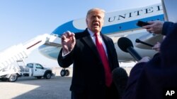 President Donald Trump speaks with reporters before boarding Air Force One Jan. 12, 2021, at Andrews Air Force Base, Maryland, to travel to Texas. 