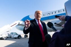 President Donald Trump speaks with reporters before boarding Air Force One Jan. 12, 2021, at Andrews Air Force Base, Maryland, to travel to Texas.
