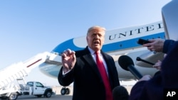 President Donald Trump speaks with reporters before boarding Air Force One Jan. 12, 2021, at Andrews Air Force Base, Maryland, to travel to Texas. 