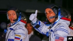 The International Space Station (ISS) crew members Joe Acaba (R) of the the U.S., and Alexander Misurkin of Russia walk after donning space suits shortly before their launch at the Baikonur Cosmodrome, Kazakhstan September 13, 2017. REUTERS/Shamil Zhumat