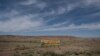 A sign promoting social distancing sits near the Navajo Nation town of Chinle, May 22,2020.