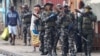 FILE PHOTO: Members of the Mozambique military patrol the streets of the capital a day after a "national shutdown" against the election outcome, in Maputo