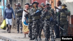 FILE PHOTO: Members of the Mozambique military patrol the streets of the capital a day after a "national shutdown" against the election outcome, in Maputo