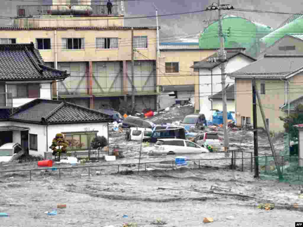 Streets are flooded after a tsunami and earthquake in Kesennuma city, Miyagi Prefecture, March 11, 2011. The biggest earthquake to hit Japan since records began 140 years ago struck the northeast coast on Friday, triggering a 10-metre tsunami that swept a