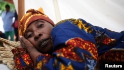 FILE - A cholera patient lies in a treatment center in Sierra Leone's capital Freetown.