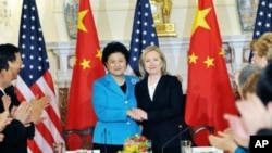Secretary of State Hillary Clinton and Chinese State Councilor Liu Yandong at the closing meeting of the U.S.-China Consultation on People-to-People Exchange at the State Department in Washington, DC.