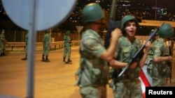 Turkish military block access to the Bosphorus bridge, which links the city's European and Asian sides, in Istanbul, Turkey, July 15, 2016. 