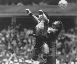 FILE - In this June 22, 1986 file photo Argentina's Diego Maradona, left, beats England goalkeeper Peter Shilton to a high ball and scores his first of two goals in a World Cup quarterfinal soccer match against England, in Mexico City.