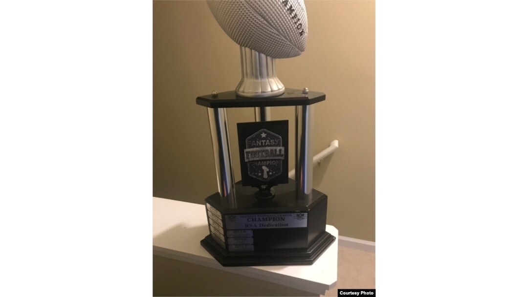 Fantasy football players like Nima Vaez-Zadeh often vie for the right to win their league's trophy for a year.