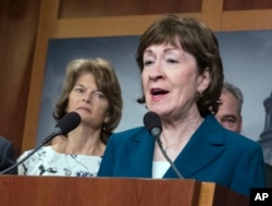 FILE - In this Feb. 15, 2018, photo, Sen. Susan Collins, R-Maine, and Sen. Lisa Murkowski, R-Alaska, left, are shown during a news conference at the Capitol in Washington.
