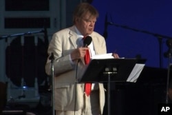FILE - Humorist Garrison Keillor hosts his final broadcast of the weekly radio variety show "A Prairie Home Companion" on July 1, 2016, at the Hollywood Bowl in Los Angeles.