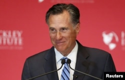 FILE - Former Republican presidential nominee Mitt Romney, pictured during an appearance in March in Salt Lake City, says Donald Trump is setting a dangerous example by promoting "trickle-down racism."