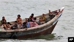 Burmese Rohingya Muslims fleeing religious violence are intercepted by Bangladesh border authorities, Taknaf, Bangladesh, June 13, 2012.