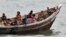 Burmese Rohingya Muslims fleeing religious violence are intercepted by Bangladesh border authorities, Taknaf, Bangladesh, June 13, 2012.