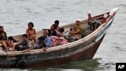 Burmese Rohingya Muslims fleeing religious violence are intercepted by Bangladesh border authorities, Taknaf, Bangladesh, June 13, 2012.