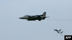 Indian fighter jets, the Mirage 2000 (L) and the Sukhoi-30 (Su-30) fighter aircraft take part in a mock exercise at the Indian Air Force Station in Gwalior, (File photo).