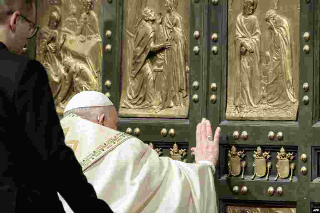 Pope Francis opens the Holy Door of St Peter&#39;s Basilica, during a special ceremony to mark the launch of the Jubilee 2025, a year of Catholic celebrations set to draw more than 30 million pilgrims to Rome, at the Vatican, Dec. 24, 2024.