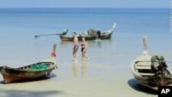 Thailand - beach with fishing boats.