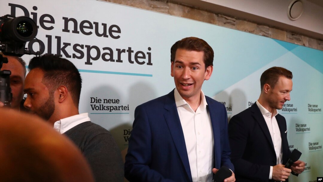 Former Austrian chancellor and top candidate of the Austrian People's Party, OEVP, Sebastian Kurz, center, arrives for a closing rally ahead of federal elections in Vienna, Sept. 28, 2019.
