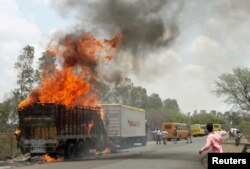 A truck burns during a farmers protest on a highway near Bhopal in the central state of Madhya Pradesh, India, June 9, 2017.