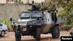 Presidential guard soldiers are seen on an armored vehicle at Laico hotel in Ouagadougou, Burkina Faso, Sept. 20, 2015. 