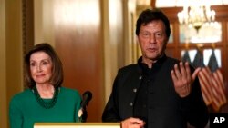 Pakistan's Prime Minister Imran Khan, right, speaks to the media with House Speaker Nancy Pelosi, July 23, 2019, on Capitol Hill in Washington. 
