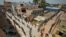 People stand on the lines by maintaining safe distance as they wait to receive free food being distributed by Central Reserve Police Force during a 21-day nationwide lockdown to slow the spreading of coronavirus in Chennai, India, April 1, 2020. 