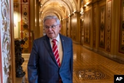 FILE - Sen. Bob Menendez, D-N.J., departs the Senate floor in the Capitol, Sept. 28, 2023, in Washington. Menendez pled not guilty to federal charges he worked to secretly advance Egyptian interests and carry out favors for local businessmen for bribes of cash and gold bars.